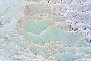 Turquoise water of thermal source in the white natural pools. Pamukkale travertine aerial landscape