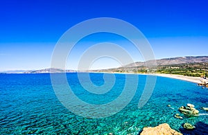 Turquoise water and white beach at village Plitra in Lakonia, Peloponnese Greece