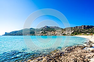 Turquoise water and white beach at village Plitra in Lakonia, Peloponnese Greece