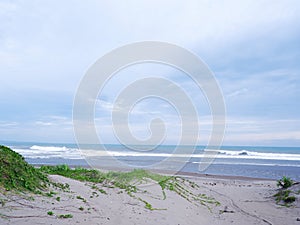 Turquoise water, white waves, blue sky, Green grass, White sand, Beautiful beach,and beautiful Island