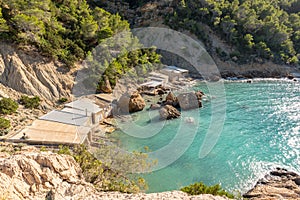 Turquoise waters in Es Portitxol, Ibiza, Spain. Hidden bay on the Island of Ibiza, in Sant Joan de Labritja. photo