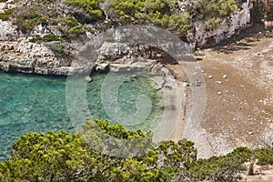Turquoise waters in Mallorca. Bota cove. Mediterranean coastline. Balearic islands photo