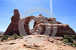 Turret Arch and Contrail, Arches National park, Utah, USA