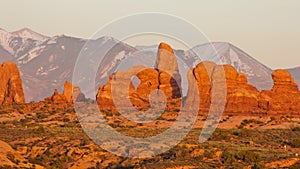 Turret Arch and La-Sal Mountains at sunset.