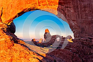 Turret Arch through the North Window at sunrise in Arches National Park near Moab, Utah