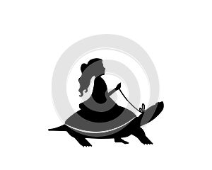 Child silhouete riding a turtle photo