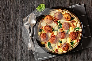 tuscan chicken meatballs with gnocchi in a dish