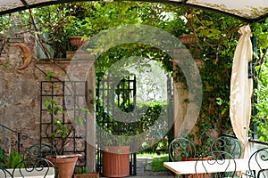 Tuscan entrance to romantical garden. Gate to Garden Patio in Tuscany.