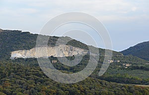 Tuscan hilly landscape defaced by a quarry