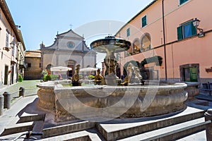 Tuscania, Viterbo, Italy: San G iacomo Maggiore cathedral, the square and the fountain