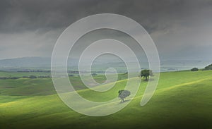 Tuscany, Crete Senesi rural sunset landscape. Countryside farm. Italy, Europe