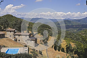 Tuscany farmhouse with swimmingpool at top of the hill