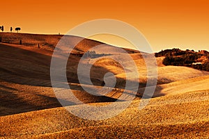 Tuscany, Italy landscape at sunset. Picturesque hills with lights and shadows.