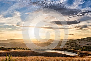 Tuscany Landscape with Sun and Cloudscape in Horizon