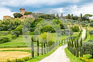 Tuscany spring, rolling hills and windmill on sunset.