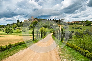 Tuscany spring, rolling hills and windmill on sunset.