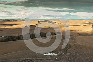 Tuscany, Val d`Arbia, Italy. October 12, 2020: Typical Tuscan landscapes.in the evening sunlight