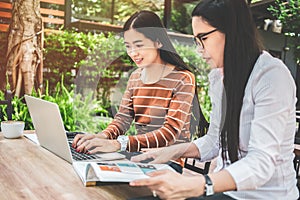 Tutor book, Asian young woman sitting pointed studying examine with teacher-student campus help catching up. using a laptop write