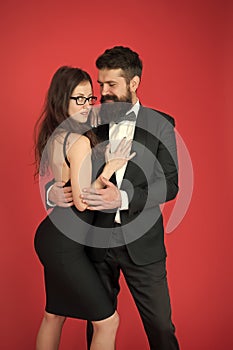 Tuxedo and dress. Formal couple. art experts of bearded man and woman. esthete. Romantic relationship. Couple in love on