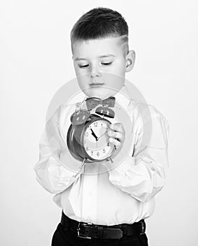 Tuxedo kid. Happy childhood. Party time. Businessman. Formal wear. Time management. Morning. little boy with alarm clock