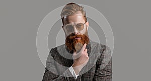 Tuxedo man in menswear isolated on grey. Redhead man in menswear tuxedo. Man wear elegant formal menswear. Elegance of photo