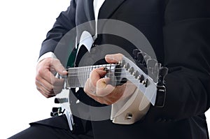 Tuxedo playing guitar