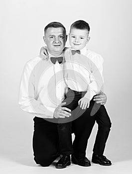 Tuxedo style. happy child with father. business meeting party. little boy with dad businessman. family day. esthete