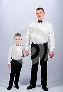 Tuxedo style. PR manager. Wedding party. happy child with father. business meeting. small boy with dad gentleman. family