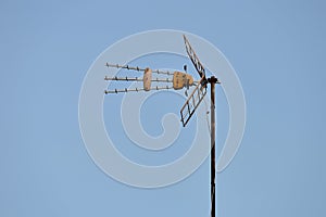 TV antenna against the blue sky