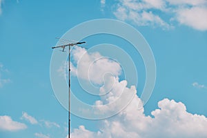 TV antenna in blue sky background
