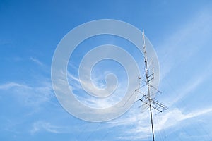 TV antenne with blue sky.