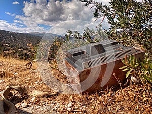 A tv as garbage on the side of the road in the PÃÂ©loponÃÂ¨se of Greece photo