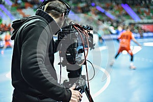 TV camera and cameraman during match