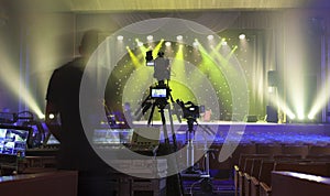 Tv camera in a concert hall.