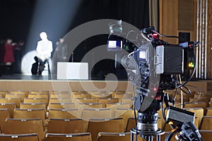 Tv camera in a concert hall.