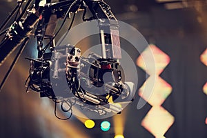 TV camera on a crane at a football match or concert. Close-up live video broadcast camera