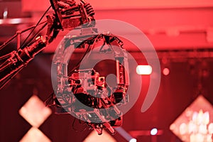 TV camera on a crane at a football match or concert. Close-up live video broadcast camera