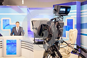 Tv camera recording male reporter or anchorman. Live broadcasting photo