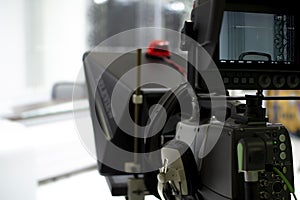 TV camera in the Studio. Teleprompter and professional high-definition video camera on a tripod.