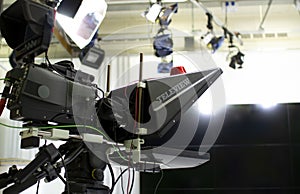 TV camera in the Studio. Teleprompter and professional high-definition video camera on a tripod.