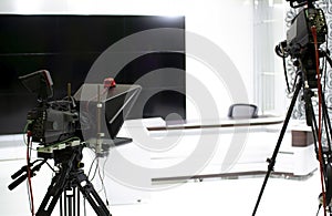 TV camera in the Studio. Teleprompter and professional high-definition video camera on a tripod.