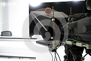 TV camera in the Studio. Teleprompter and professional high-definition video camera on a tripod.