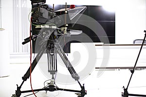 TV camera in the Studio. Teleprompter and professional high-definition video camera on a tripod
