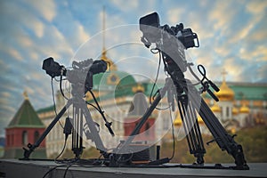 TV cameras stand against the background of the Kremlin in Moscow