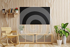 TV on the dark wood wall with beautiful pattern Decorated with plants and bookshelves and a wooden cabinet and rocking chair in