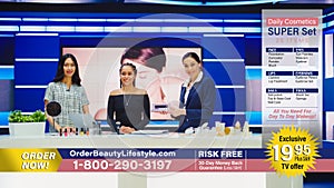 TV Infomercial Program: Female Host, Makeup Artist uses Eyeshadow Palette on Beautiful Model photo