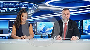 TV Live News Program: Two Diverse Professional Presenters Reporting On the Events. Television Cable