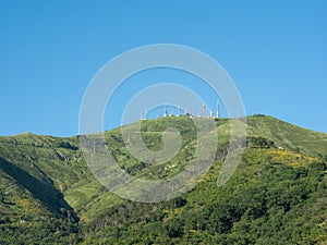 TV mast and telecommunication antennas on top of a mountain photo