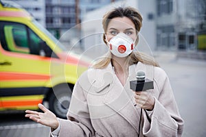 TV news reporter is making reportage about a virus epidemic in the city