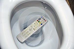 The TV remote accidentally fell into the toilet.